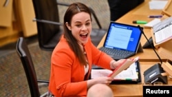 FILE - Scotland's Finance Secretary Kate Forbes reacts during the 2022 Scottish Budget at Scottish Parliament Building, in Edinburgh, Britain, Dec. 9, 2021. 