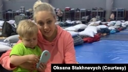 Oksana Stakhnevych, a Ukrainian refugee, and her son at a temporary shelter in 2022 where she stayed while on the Mexican-U.S. border. Courtesy of Oksana Stakhnevych. 
