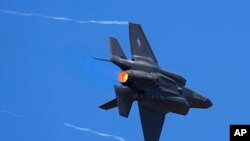 FILE - U.S. Air Force fighter aircraft F-35 performs aerobatic maneuvers on the second day of the Aero India 2023 at Yelahanka air base in Bengaluru, India, Tuesday, Feb. 14, 2023.