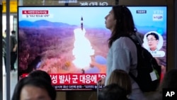 A news program broadcasts a file image of a missile launch by North Korea, at the Seoul Railway Station in Seoul, South Korea, May 30, 2024.