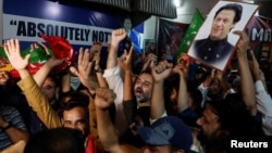 Supporters of former Prime Minister Imran Khan's party, the Pakistan Tehreek-e-Insaf (PTI), celebrate after a high court in Pakistan overturned Khan's conviction on charges of leaking state secrets, in Karachi, Pakistan, June 3, 2024.