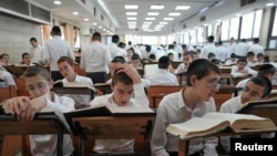 Ultra-Orthodox Jewish seminary students study on the day that Israel's military begins sending out draft orders for ultra-Orthodox Jewish men, at the Kol Torah Jewish seminary in Jerusalem, July 21, 2024. 