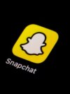 FILE - The icon for Snapchat is seen on a smartphone, Feb. 28, 2023, in Marple Township, Pa.