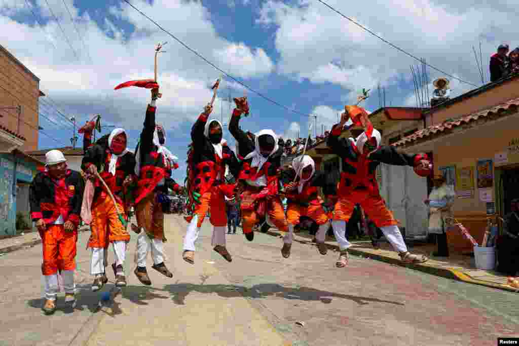 Members of the indigenous Tzotzil community perform during last day of the carnival known as K'in Tajimoltic (Fiesta del Juego) in San Juan Chamula, in Chiapas state, Mexico, Feb. 21, 2023. 