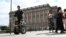 A police officer on a Segway patrols Sweden's parliament building as the terror threat level in Sweden is raised to four on a five-point scale, in Stockholm, Sweden, Aug. 17, 2023. (Fredrik Sandberg/TT News Agency/via Reuters)