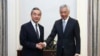 FILE - Chinese Foreign Minister Wang Yi, left, meets with Singapore's Prime Minister Lee Hsien Loong in Singapore on Aug. 11, 2023.