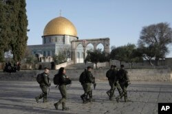 Israeli police escort Jewish visitors marking the holiday pf Passover to the Al-Aqsa Mosque compound, known to Muslims as the Noble Sanctuary and to Jews as the Temple Mount, Apr. 5, 2023.