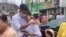 FILE - A man is welcomed by his mother after his release from Insein Prison in Yangon, Myanmar, May 3, 2023. VOA Burmese says there are still about 40 journalists locked up in prisons across the country.