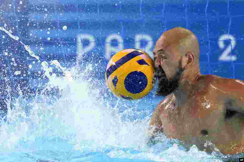 Japan&#39;s Katsuyuki Tanamura reaches for a shot during a Japan men&#39;s water polo team training session at the Olympic Aquatics Centre, ahead of the 2024 Summer Olympics in Saint-Denis, France. (AP Photo/Luca Bruno)