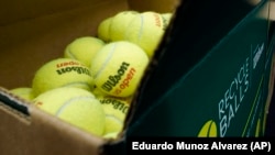 A box of game-used tennis balls are packed in a recycling box during the U.S. Open tennis championships, Monday, Sept. 4, 2023, in New York. AP Photo/Eduardo Munoz Alvarez)