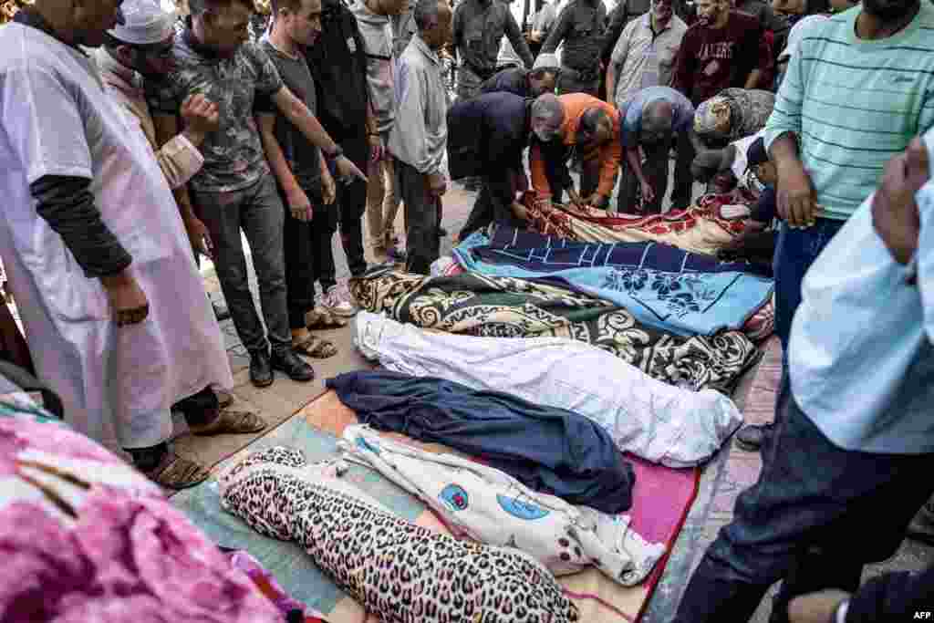 Relatives mourn in front of the bodies of the victims killed in an earthquake in Moulay Brahim, Al Haouz province, Morocco, on Sept. 9, 2023. 