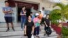 Members of the Shenzhen Holy Reformed Church, also known as the Mayflower Church, leave from the Nongprue police station on their way to Pattaya Provincial Court in Pattaya, Thailand, on March 31, 2023.