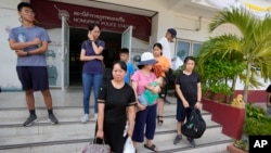 Members of the Shenzhen Holy Reformed Church, also known as the Mayflower Church, leave from the Nongprue police station on their way to Pattaya Provincial Court in Pattaya, Thailand, on March 31, 2023.