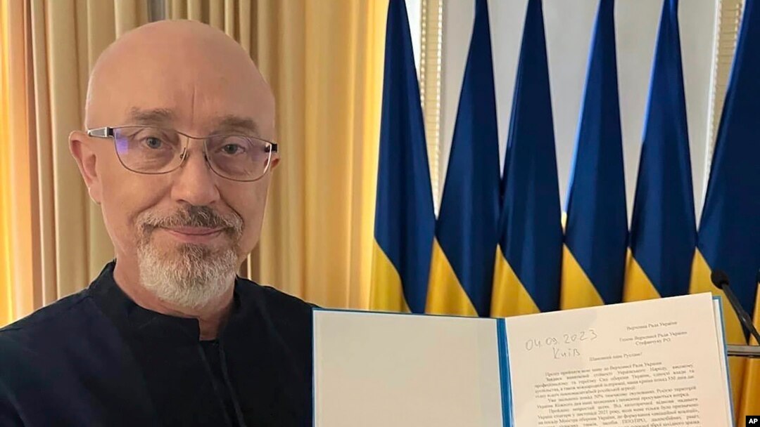 In this photo provided by the Ukrainian Parliament Press Office, Ukrainian Defense Minister Oleksii Reznikov shows his resignation letter addressed to the parliamentary speaker in Kyiv, Ukraine, Sept. 4, 2023.