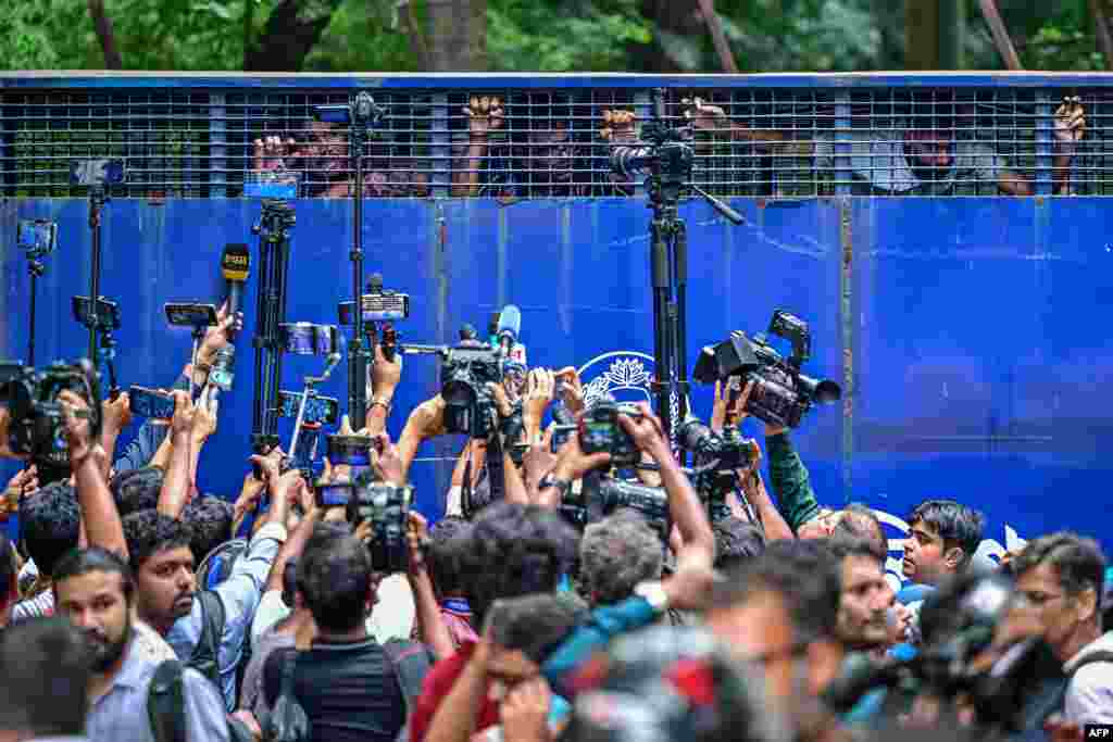 Protesters are being detained in a police van while protesting outside the High Court building as they demand justice for the victims arrested and killed in the recent countrywide violence in Dhaka, Bangladesh.