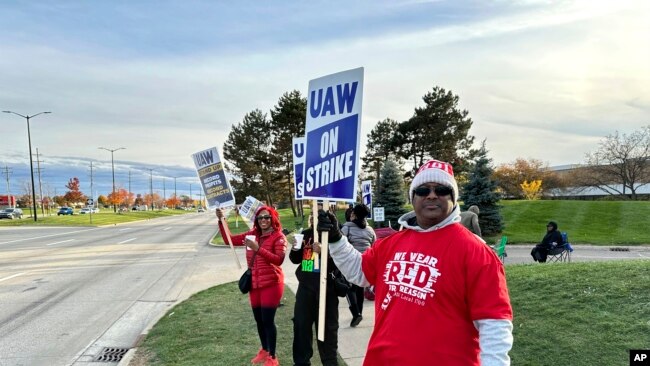 Anthony Collier, 54, and other striking United Auto Workers members picket outside the Stellantis Sterling Heights Assembly plant in Michigan, Oct. 28, 2023. Jeep maker Stellantis reached a tentative contract agreement with the union on the same day.