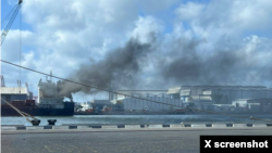 This screen capture of a picture shared by X user Iran Spectator shows the Turkish-owned cargo ship Yaf Horizon, which caught fire while docked at the Port of Haifa, in Israel, on June 10, 2024.