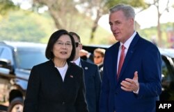 US Speaker of the House Kevin McCarthy (R-CA) speaks with Taiwan President Tsai Ing-wen while arriving for a bipartisan meeting at the Ronald Reagan Presidential Library in Simi Valley, California, Apr. 5, 2023.