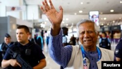 Nobel laureate Muhammad Yunus, who was recommended by Bangladeshi student leaders as the head of the interim government in Bangladesh, waves at Paris Charles de Gaulle airport in Roissy-en-France, France, Aug. 7, 2024.