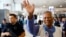 Nobel laureate Muhammad Yunus, who was recommended by Bangladeshi student leaders as the head of the interim government in Bangladesh, waves at Paris Charles de Gaulle airport in Roissy-en-France, France, Aug. 7, 2024.
