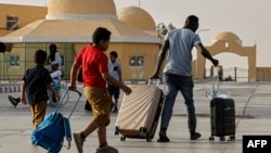 Passengers fleeing war-torn Sudan cross into Egypt through the Argeen Land Port on May 12, 2023.