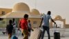 Passengers fleeing war-torn Sudan cross into Egypt through the Argeen Land Port on May 12, 2023.