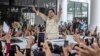 FILE- Prabowo Subianto greets supporters during a campaign rally in Medan, North Sumatra, Indonesia, Jan. 13, 2024. Subianto has been confirmed, March 20, 2024, as the victor of last month's presidential election over two former governors.