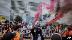 Protesters attend a march called by the mother of 17-year-old Nahel Merzouk who was killed by police to mark one year since his death, in Nanterre, west of Paris, June 29, 2024. 