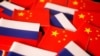 FILE - Flags of China and Russia are displayed in this illustration picture taken March 24, 2022. 
