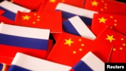 FILE - Flags of China and Russia are displayed in this illustration picture taken March 24, 2022. 