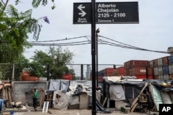 Shacks stand in the Padre Carlos Mugica neighborhood of Buenos Aires, Argentina, Dec. 14, 2023. Argentina's government has cut transportation and energy subsidies and devaluated the peso to deal with an economic emergency.