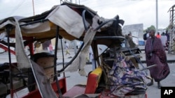 FILE - A destroyed tuktuk sits outside the Pearl Beach hotel in Mogadishu, Somalia, on June 10, 2023. State media said extremists attacked the hotel. The Somali government said on Sept. 6, 2023, that it is shifting tactics in its fight against al-Shabab militants. 