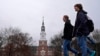 FILE - Students cross the campus of Dartmouth College in Hanover, New Hampshire, March 5, 2024. After months of delays and technical hiccups, some colleges and universities have started to receive federal data they need to put together financial aid offers for incoming students. 