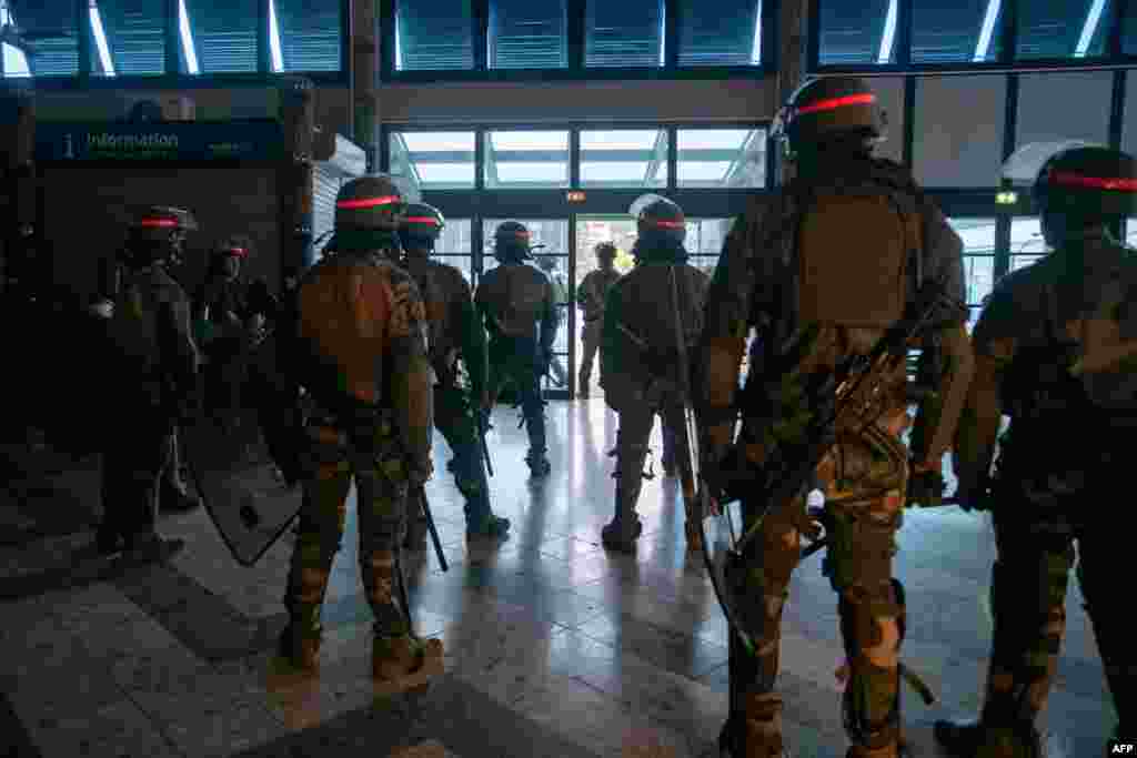 French soldiers of the 8th Marine Infantry Regiment secure the Magenta airport in Noumea, France's Pacific territory of New Caledonia, amid a state of emergency following the deadliest violence in the area since the 1980s.
