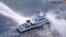 This frame grab from handout video footage taken by the Philippine Coast Guard shows the Philippine Coast Guard ship BRP Bagacay being hit by water cannon from Chinese coast guard vessels near the Scarborough shoal. (Philippine Coast Guard / AFP)