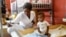 A nurse cares for an infant at the Centre Hospitalier de Fontaine, located in the impoverished neighborhood of Cite Soleil, where the two rival gangs, G-Pep and G9, are based, in Port-au-Prince, Haiti, July 26, 2023. 