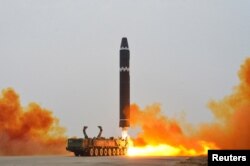 FILE - A Hwasong-15 intercontinental ballistic missile (ICBM) is launched at Pyongyang International Airport, in Pyongyang, North Korea, Feb. 18, 2023 in this photo released by North Korea's Korean Central News Agency (KCNA).