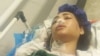 Arezou Badri is seen hospitalized in Iran after she was shot by Iranian police while driving in a car in the northern province of Mazandaran, July 22, 2024. This photo was sent to VOA Persian TV host Masih Alinejad by a source inside Iran. 