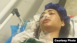 Arezou Badri is seen hospitalized in Iran after she was shot by Iranian police while driving in a car in the northern province of Mazandaran on July 22, 2024. This photo was sent to VOA Persian TV host Masih Alinejad by a source inside Iran. 