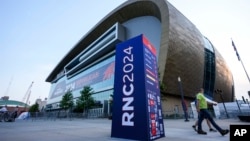 People walk outside the Fiserv Forum ahead of the 2024 Republican National Convention, July 13, 2024, in Milwaukee