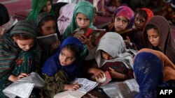 Children recite holy book Quran at a mosque in Lahore, Pakistan.
