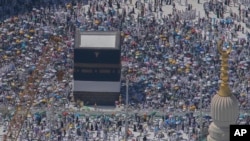 FILE - Muslim pilgrims circumambulate the Kaaba, the cubic building at the Grand Mosque, during the annual Hajj pilgrimage in Mecca, Saudi Arabia, June 17, 2024.