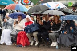 Guests attend the Paralympic Flame lighting ceremony in Stoke Mandeville, widely considered the birthplace of the Paralympic Games, England, Aug. 24, 2024.