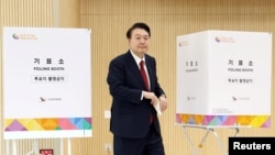 FILE - South Korean President Yoon Suk Yeol casts his early vote for 22nd parliamentary election, in Busan, South Korea, April 5, 2024. (Yonhap via Reuters)