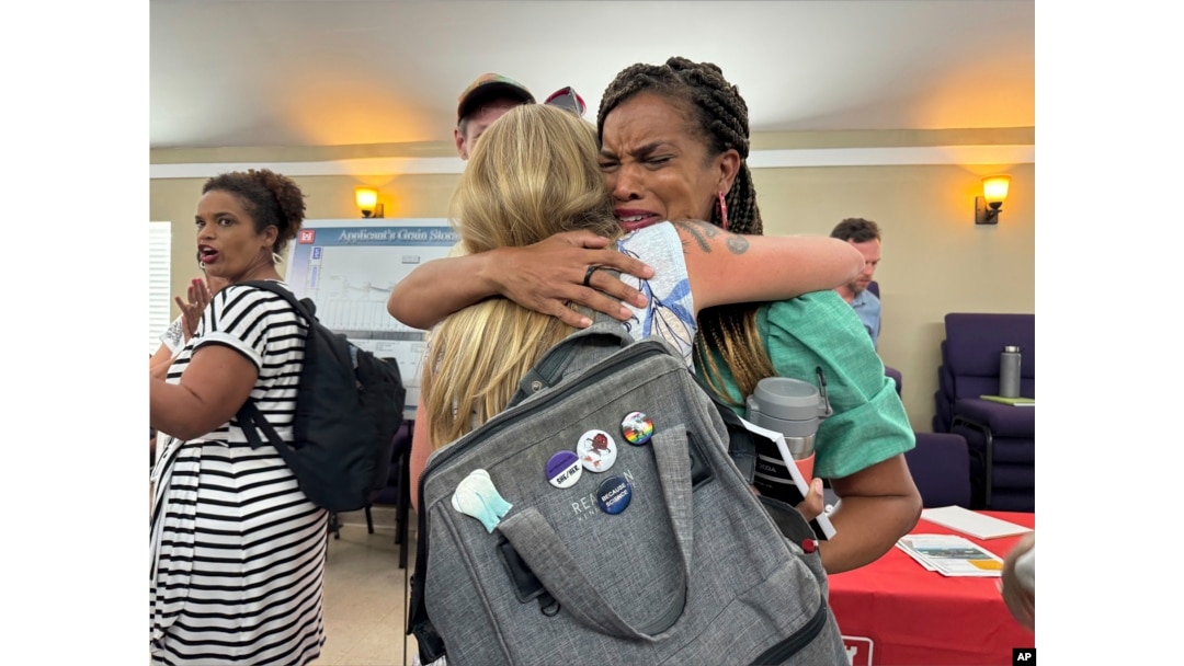 Joy Banner, co-founder of The Descendants Project and a leader in the fight against Greenfield, hugs a supporter moments after hearing that the company would cease plans for a grain elevator facility in the middle of her hometown of Wallace, Aug. 6, 2024.