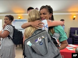 Joy Banner, co-founder of The Descendants Project and a leader in the fight against Greenfield, hugs a supporter moments after hearing that the company would cease plans for a grain elevator facility in the middle of her hometown of Wallace, Aug. 6, 2024.