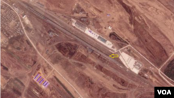 북러 접경 지역 북한 쪽 지대를 촬영한 지난달 17일 자 위성사진. 790m 길이의 열차(화살표)가 정차 중이다. 사진=Planet Labs