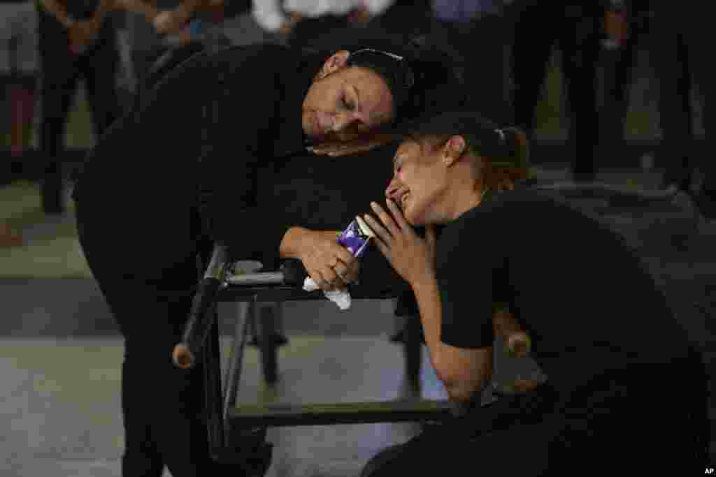 Mourners grieve beside the body of Mapal Adam, during her funeral in Tel Aviv, Israel.&nbsp;Adam was killed by Hamas militants on Oct. 7 as they carried out an unprecedented, multi-front attack that killed over 1,000 Israelis.