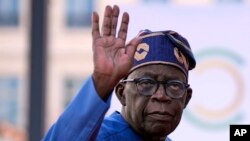 FILE - Nigeria's President Bola Tinubu arrives for the closing session of the New Global Financial Pact Summit, on June 23, 2023 in Paris.