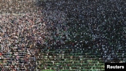 A drone view shows Albanian Muslims attending Eid al-Fitr prayers to mark the end of the holy fasting month of Ramadan, at Skanderbeg Square in Tirana, Albania.